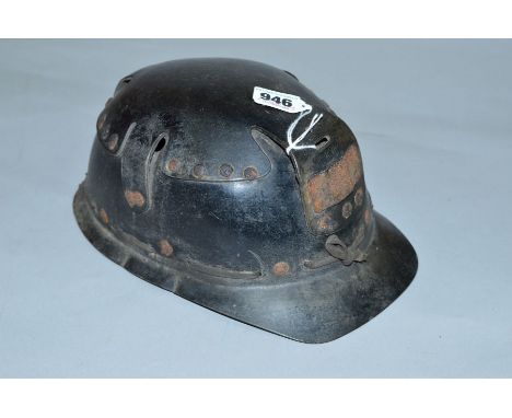 A VINTAGE MINERS HELMET, not marked but possibly a Huwood 'Light Type Hat', circa mid 20th century 