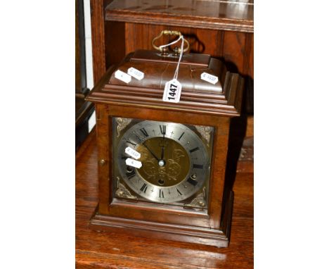 ELLIOTTS OF LONDON ,a mahogany bracket clock with single carrying handle, brass and silvered dial with Roman numerals, height
