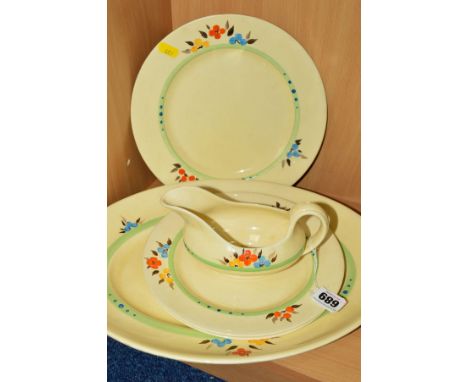 CLARICE CLIFF FOR WILKINSON LTD, a part dinner service, to include 'Honeyglaze' sauce boat, an oval platter and three dinner 