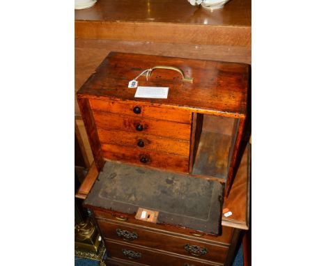 AN EARLY 20TH CENTURY OAK ENGINEERS CHEST, the fall front door revealing three drawers and an open shelf (with providence of 