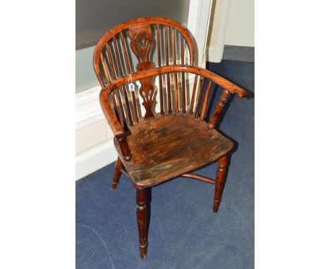 A 19TH CENTURY YEW WOOD AND ELM STICK BACK WINDSOR ARMCHAIR, on a crinoline stretcher