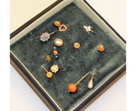 A group of Victorian gold silver and gem set tie pins, including a Connemera agate three leaf clover pin, seed pearl set hear