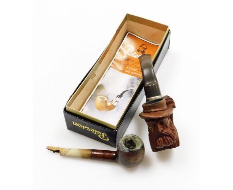 Two pipes, to include a carved wooden meerschaum pipe, and another with wooden finish. (2 AF)