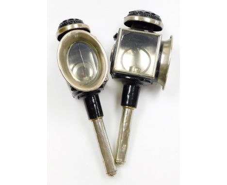 A pair of carriage lanterns, with black coloured finish, with patent stamp and oval light plaque, 45cm high. (2)
