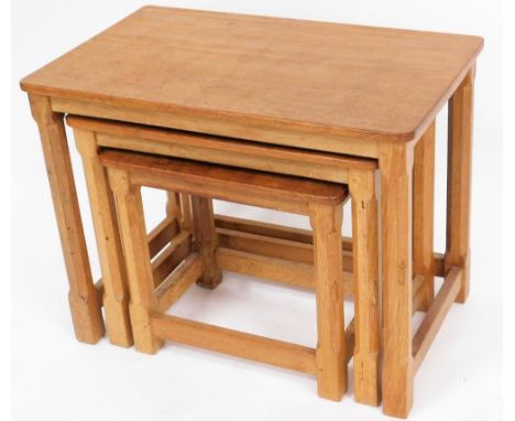 A Robert Thompson of Kilburn 'Mouseman' nest of three oak tables, bearing carved mouse to a leg of each table, the largest 47