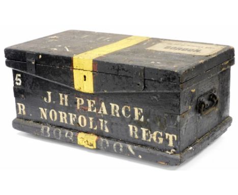 A Royal Norfolk Regiment army chest for J H Pearce of The Norfolk Regiment, with applied Bodon paper label painted black with