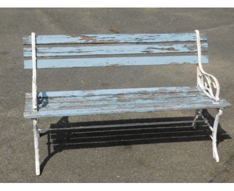 A cast metal garden bench, with blue painted wooden slats and white painted ends, 72cm high, 122cm wide, 42cm deep.