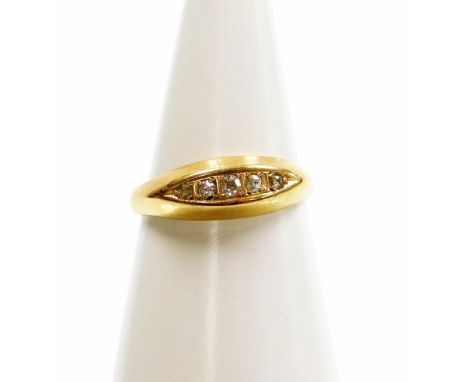 An 18ct gold diamond set gypsy ring, set with five tiny diamonds, ring size M, 1.8g all in. 