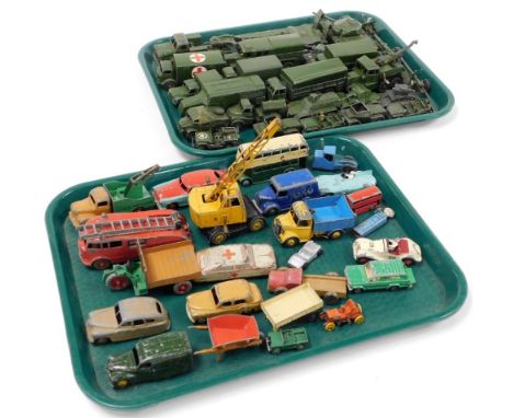 A group of diecast toys, to include Dinky Toys emergency vehicles, cranes and cars, Dinky Toys army vehicles, etc., all play 