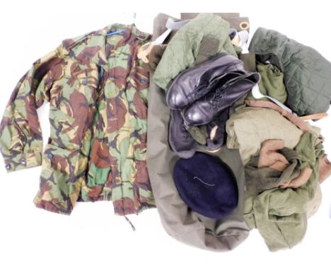 Various army uniforms, to include a camouflage arm jacket, kit bag, shoes and accessories. 