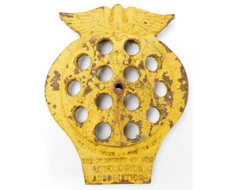 A large Automobile Association cast metal badge, painted yellow with wing decoration to top and pierced circle central body, 