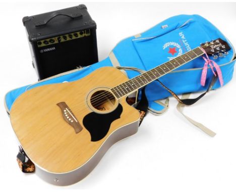 An electric acoustic guitar, with Yamaha speaker.