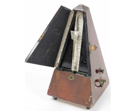 A cased metronome, by Maelzel, 23cm high. 