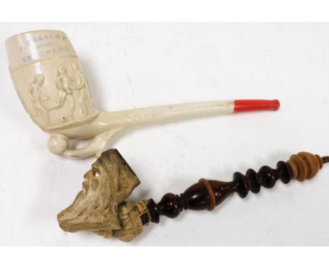 Two pipes, a decorative pipe with bearded figure head and turned wooden handle, 21cm wide, and a present from Skegness Footba