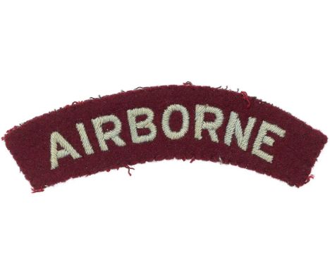 WW2 AIRBORNE cloth embroidered shoulder title.Light blue sans-serif letters embroidered on slightly curved maroon felt.    Re