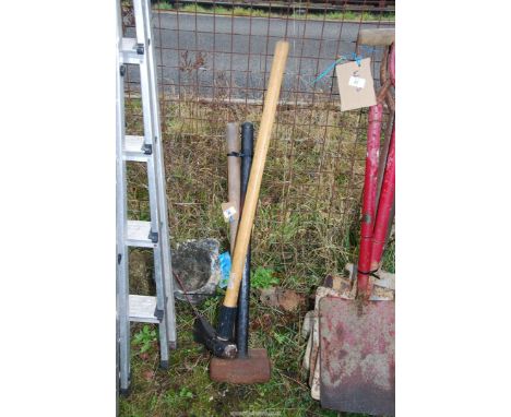 Two sledge hammers and an axe.
