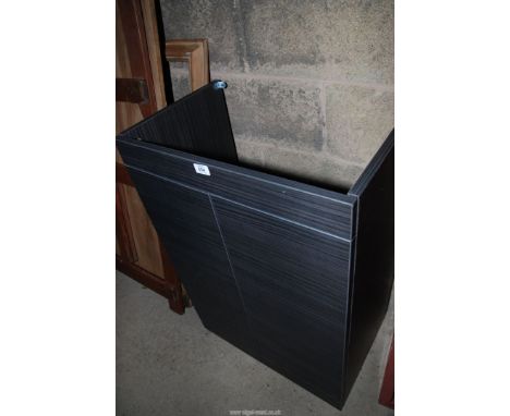 A two door floor standing wash basin unit, 24'' x 34'' x 15''.