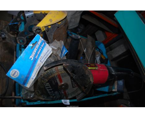 A crate of tools to include angle grinder, sander, saw, a work light, etc.