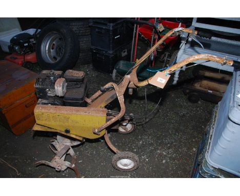 A petrol rotary tiller. (Good compression).