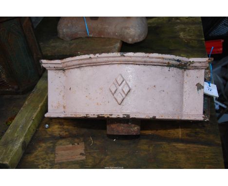 A cast iron rain hopper.