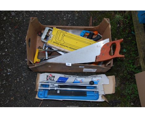 A tile cutter, hand saws, etc.