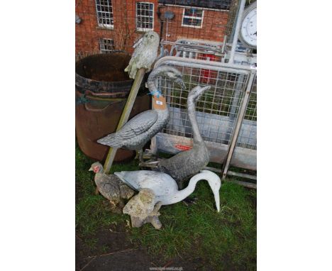 A quantity of garden ornaments to include two metal swans.
