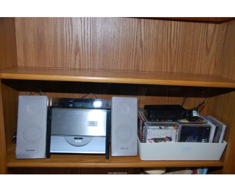 A "Panasonic" CD stereo system, a box of CD's, and a Dab radio.