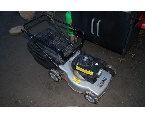 A "Mountfield" RS100 lawn mower (The engine turns and has good compression).