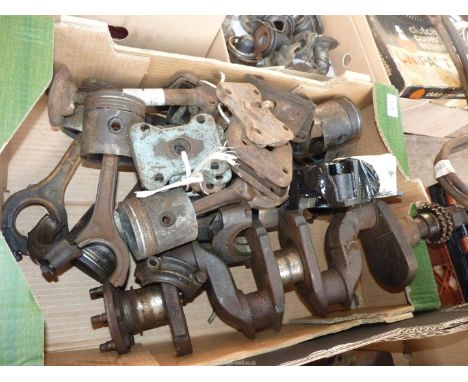 A box of A50/60 spares including spare wheel jack, an A50/60 engine crank shaft, twelve A50/60 rear axle spring base plates a