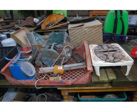 An old camping stove, hurricane lamps, scales, galvanised plant pots, etc.