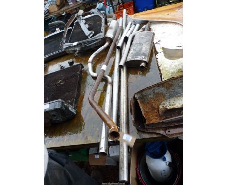 A quantity of exhaust pipe and silencers. Some being stainless steel.
