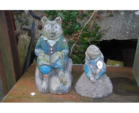 Two composite garden ornaments - a fox and a mole.