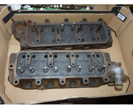 Two Engine Cylinder Heads and 10 valves, one (marked Pat No. 565394) appears to be well- designed chambers for gas flow and i