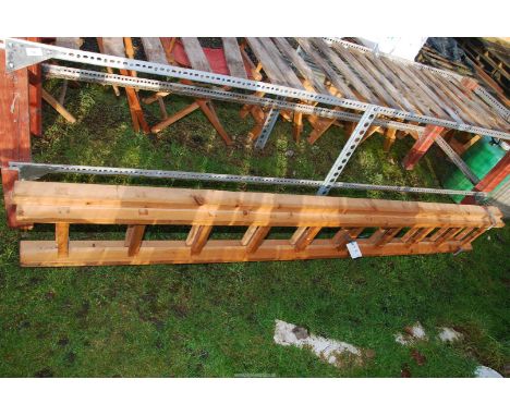 A wooden extending ladder.