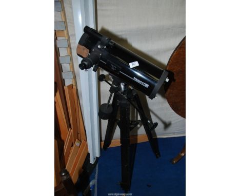 A "Tasco" telescope.