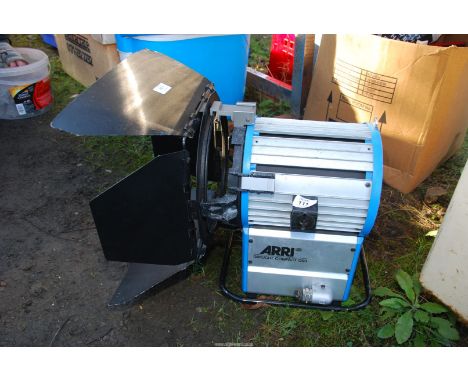 An "Arri" daylight compact 1200 spot/flood light (no bulb).