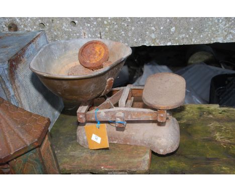 An "H. Pooley & Sons Ltd." vegetable scales and weights.