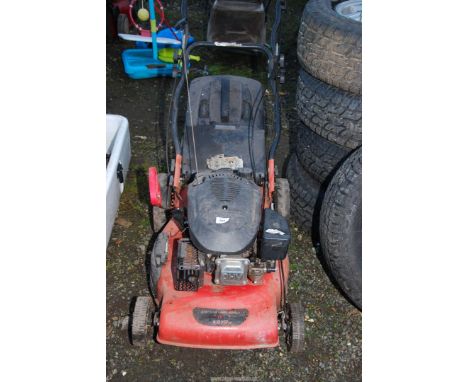 A petrol lawn mower (The engine turns and has good compression).