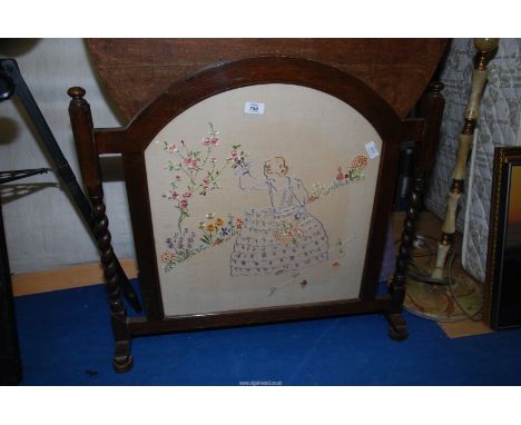A tapestry fire screen.
