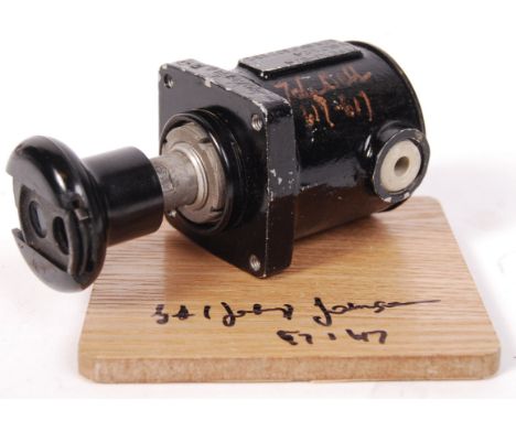 An original WWII Second World War Air Ministry Lancaster Bomber feathering switch Type XJ-D/4. Autographed to the body by Lan