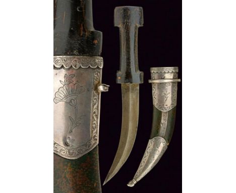 dating: 19th Century provenance: Turkey, Curved, double-edged blade, with central raiser, in damask wootz. Horn, double 'T' g