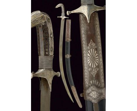 dating: 19th Century provenance: Syria, Curved, single-edged blade in fine damask wootz (some dent on the edge). Small, silve