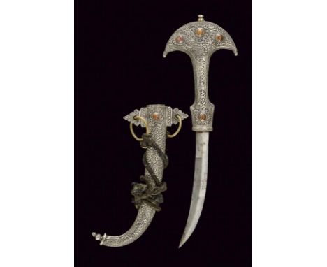 dating: early 20th Century provenance: Morocco, Curved, single-and false-edged blade. Silver grip richly decorated with rince