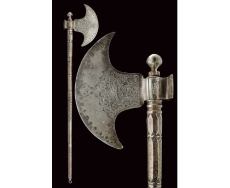 dating: 19th Century provenance: Indopersia, Round-edged axe, with Arabic writings among floral motifs, the border decorated 