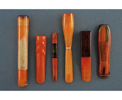 dating: First half of the 20th Century provenance: Europe, In amber, of different shapes, one with wooden haft. length 7.5 - 