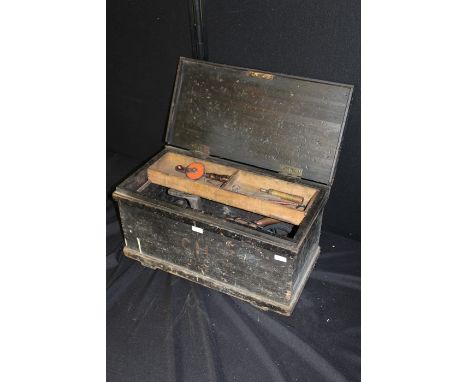 Black painted pine tool box with interior removable tray, containing a quantity of animal traps, hand tools, brass roasting j
