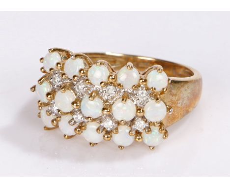9 carat gold opal set ring, with three rows of round opals 