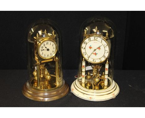 Brass anniversary clock housed under a glass dome, anniversary clock with foliate decoration, housed under a glass dome (2)