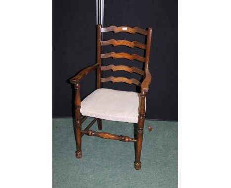 Ladder back elbow chair, with over stuffed seat, on turned legs and stretchers