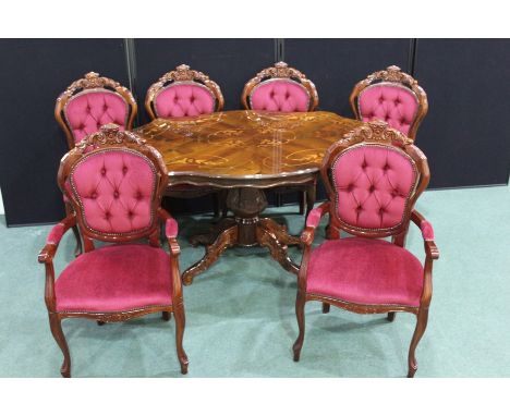 French style dining table and chairs, the table of quatrefoil form with foliate marquetry decoration, on an acanthus leaf car